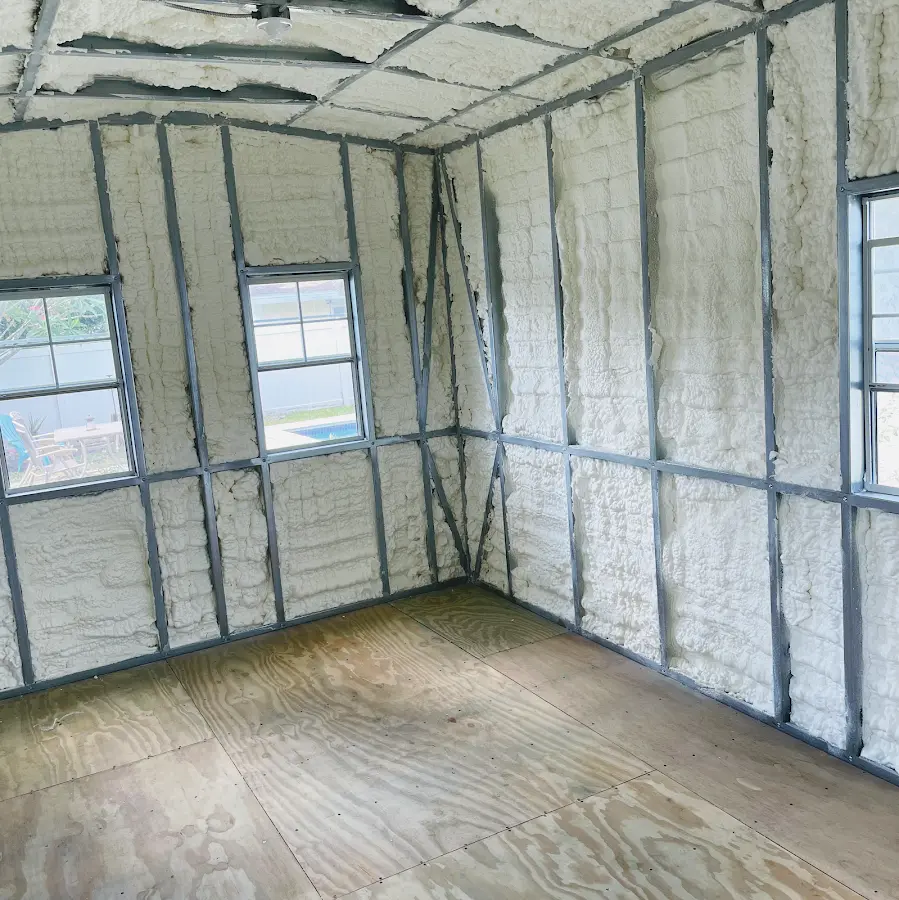 Closed-cell spray foam insulation applied to wall cavities in a residential project in Dorr